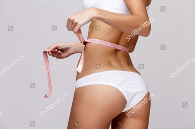 stock-photo-slim-tanned-woman-s-body-over-gray-background-401353651-aangep